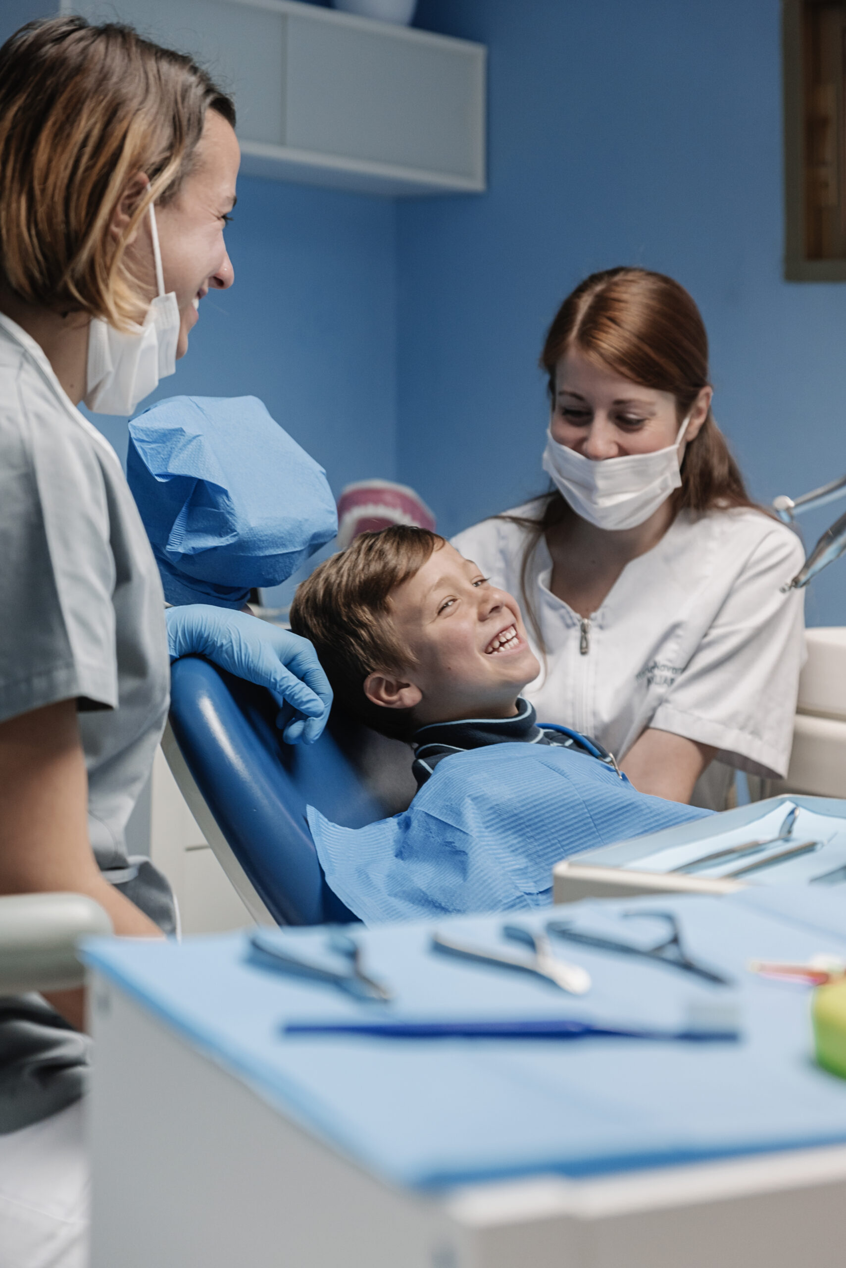 Dentists with a patient during a dental intervention to boy. Dentist Concept